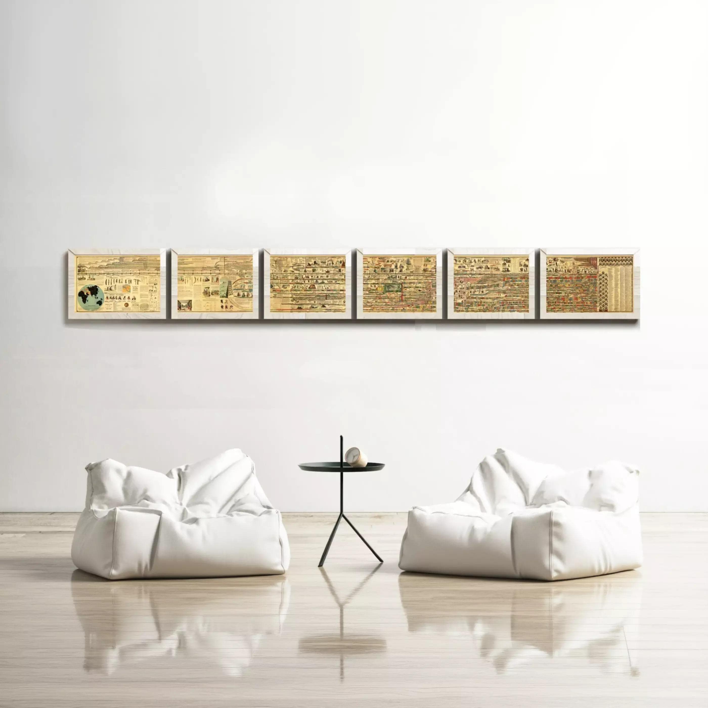 a minimalist living room with a white sofa and a small black table in the center. Above the sofa, there is a row of six framed artworks displayed on the wall, creating a cohesive and visually appealing arrangement.