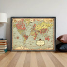 The image is a framed vintage world map with a black border and a decorative border around the edges.