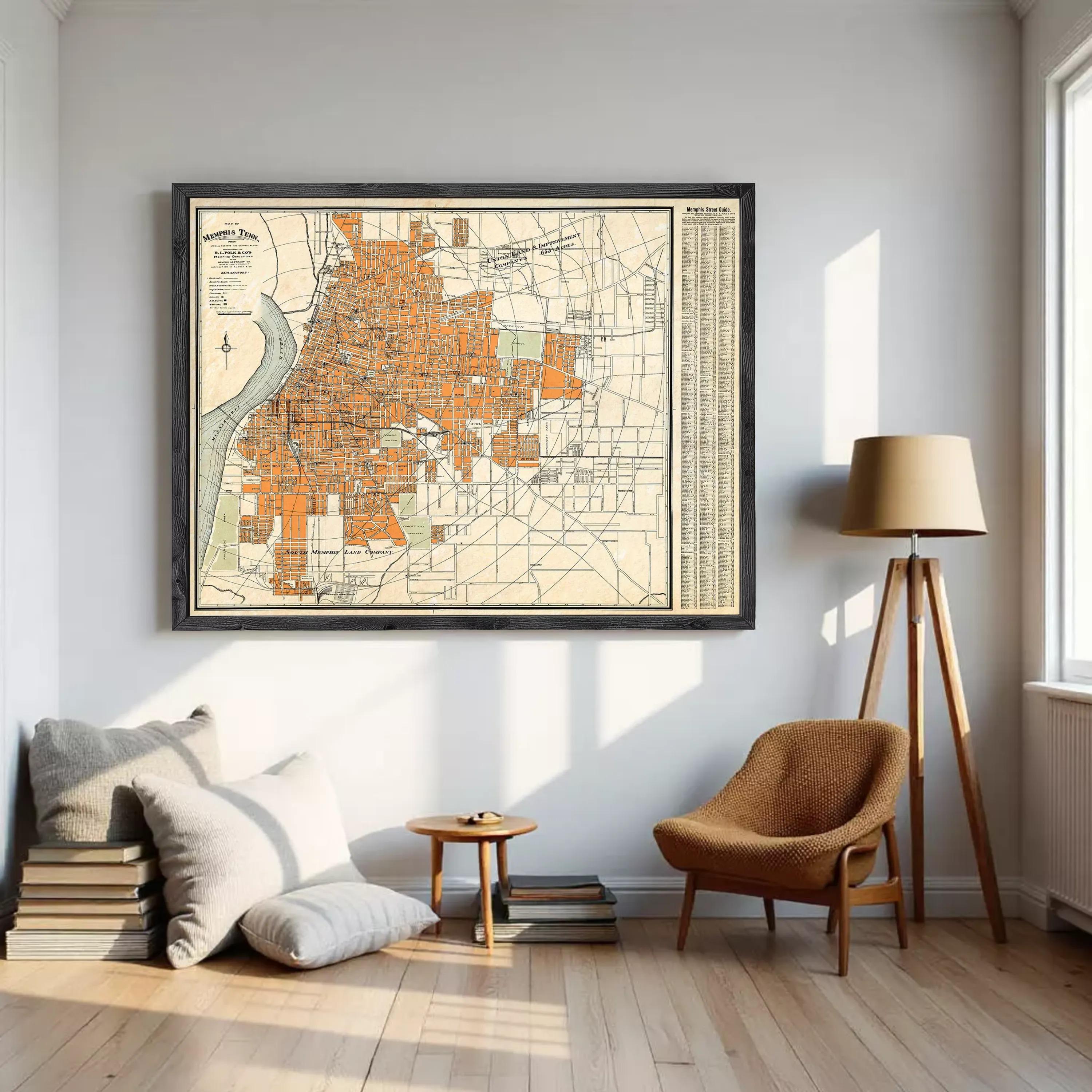 The image is a framed vintage map of a city, likely Memphis, Tennessee, with a detailed layout of streets, buildings, and other urban features.
