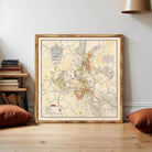 The image is a framed map of a city, depicting various streets, landmarks, and other geographical features.