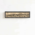 The image is a framed artwork depicting a cityscape with various buildings, ships, and people.
