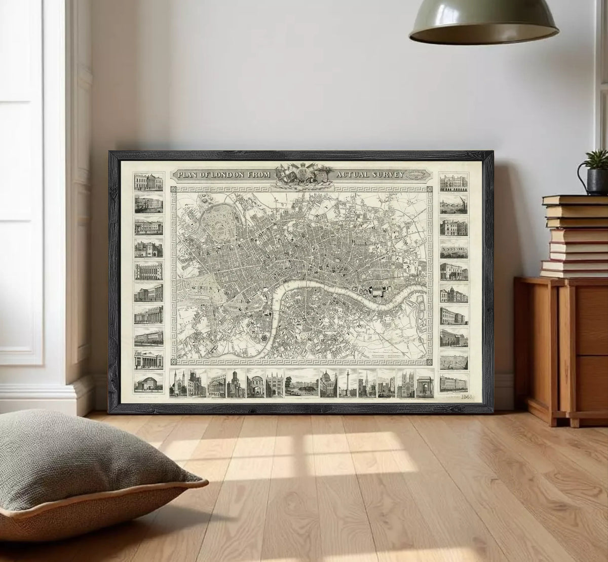The image is a framed vintage map of London, England, featuring a detailed illustration of the city's streets, landmarks, and surrounding areas.