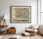 The image is a framed vintage map of a city, depicting a detailed layout of streets, buildings, and other urban features.