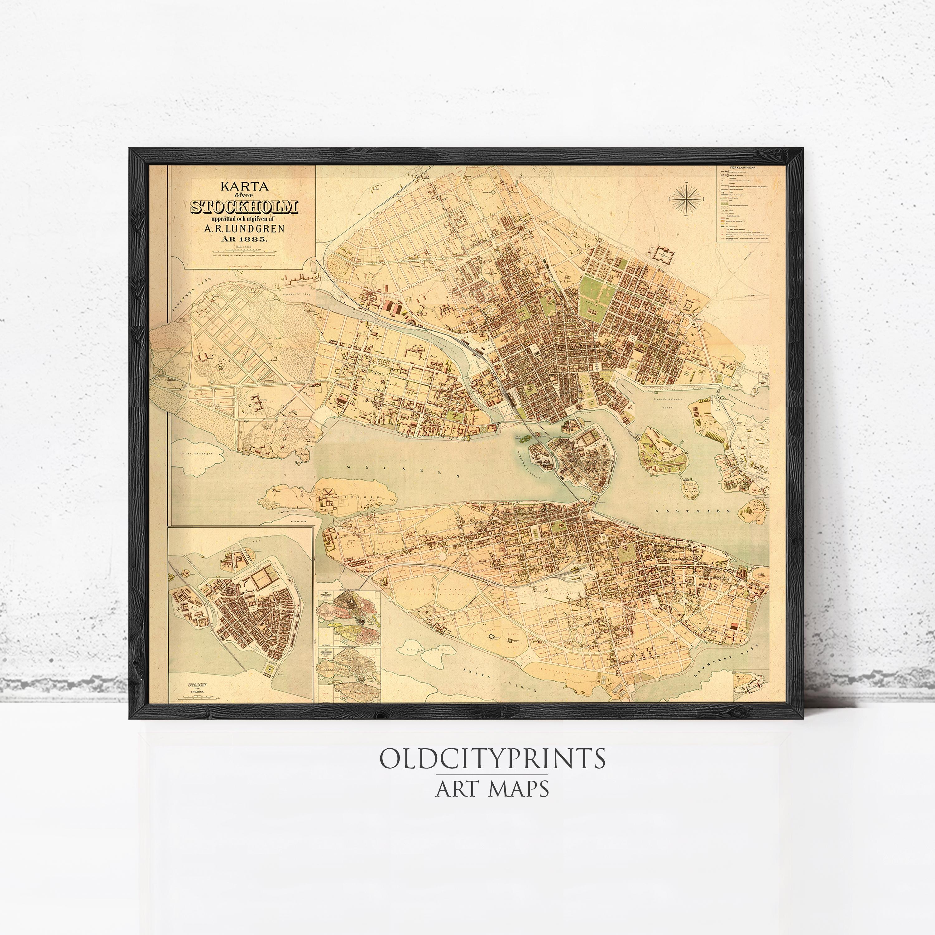 The image is a framed vintage map of a city, likely from the 19th century, depicting the city's layout and surrounding areas.