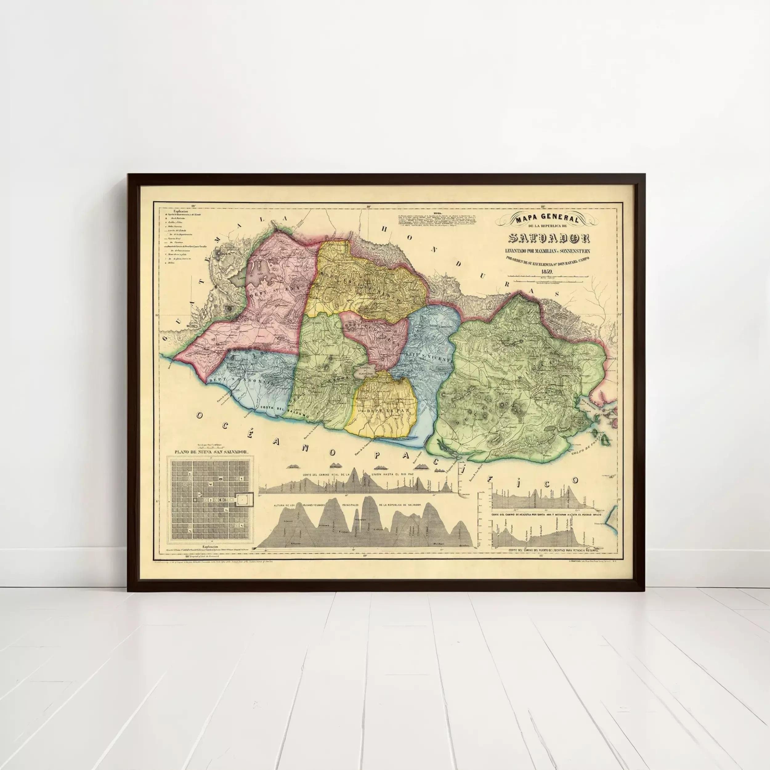 The image is a framed vintage map of a region, likely depicting a country or region, with various colored regions and a silhouette of a mountain range.