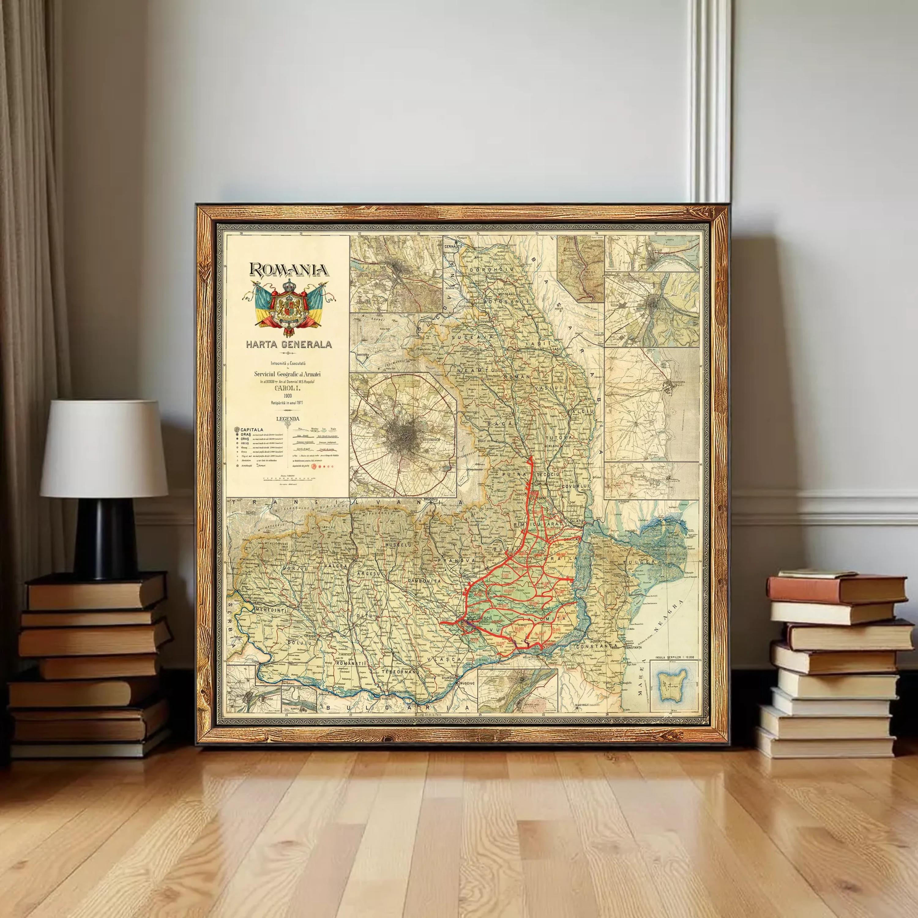 a large framed map of Romania, with a vintage style and a wooden frame. The map is surrounded by a stack of books and a lamp, creating a cozy and intellectual atmosphere.