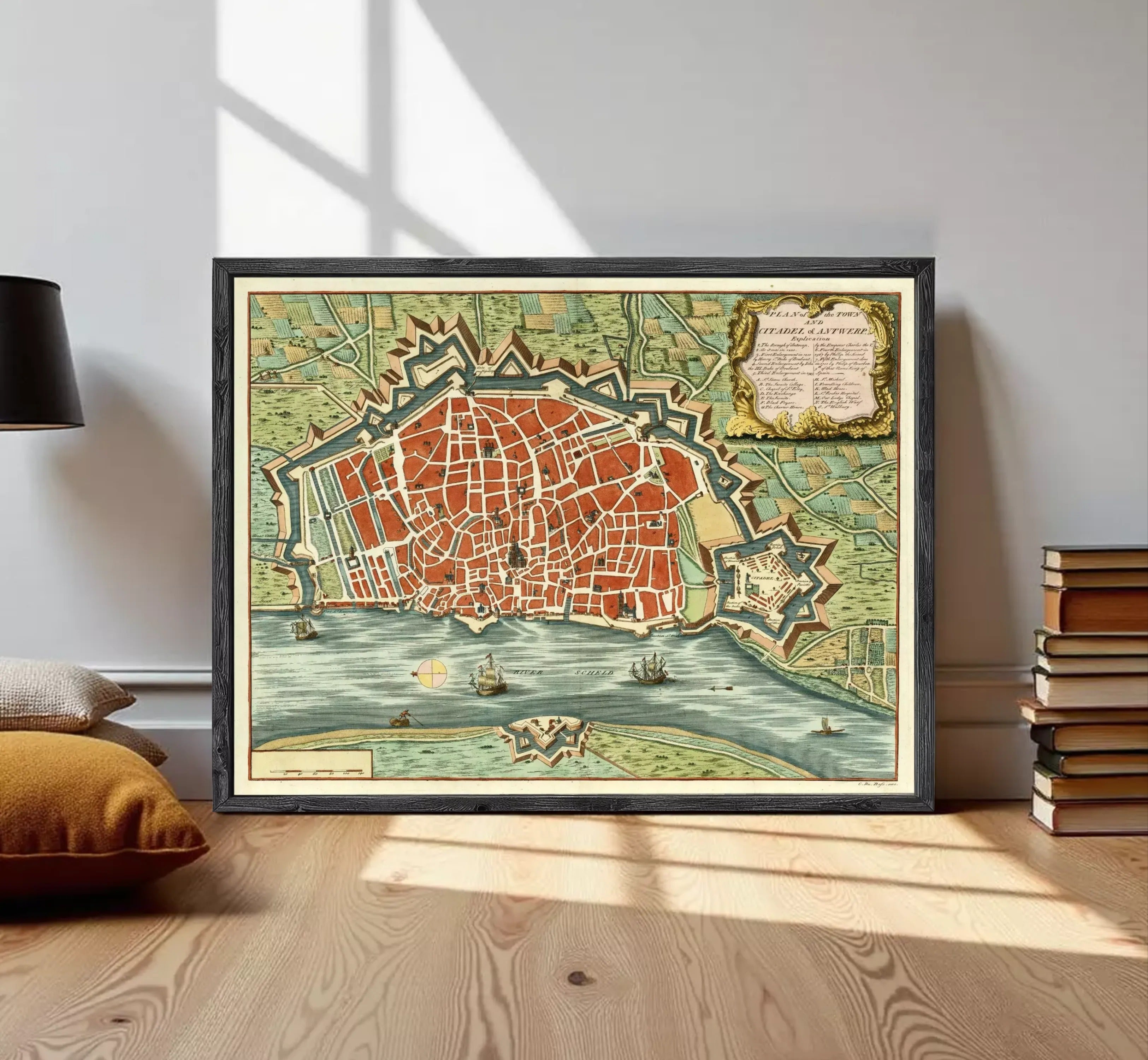 The image is a framed vintage map of a city, depicting a detailed layout of the streets, landmarks, and surrounding areas.