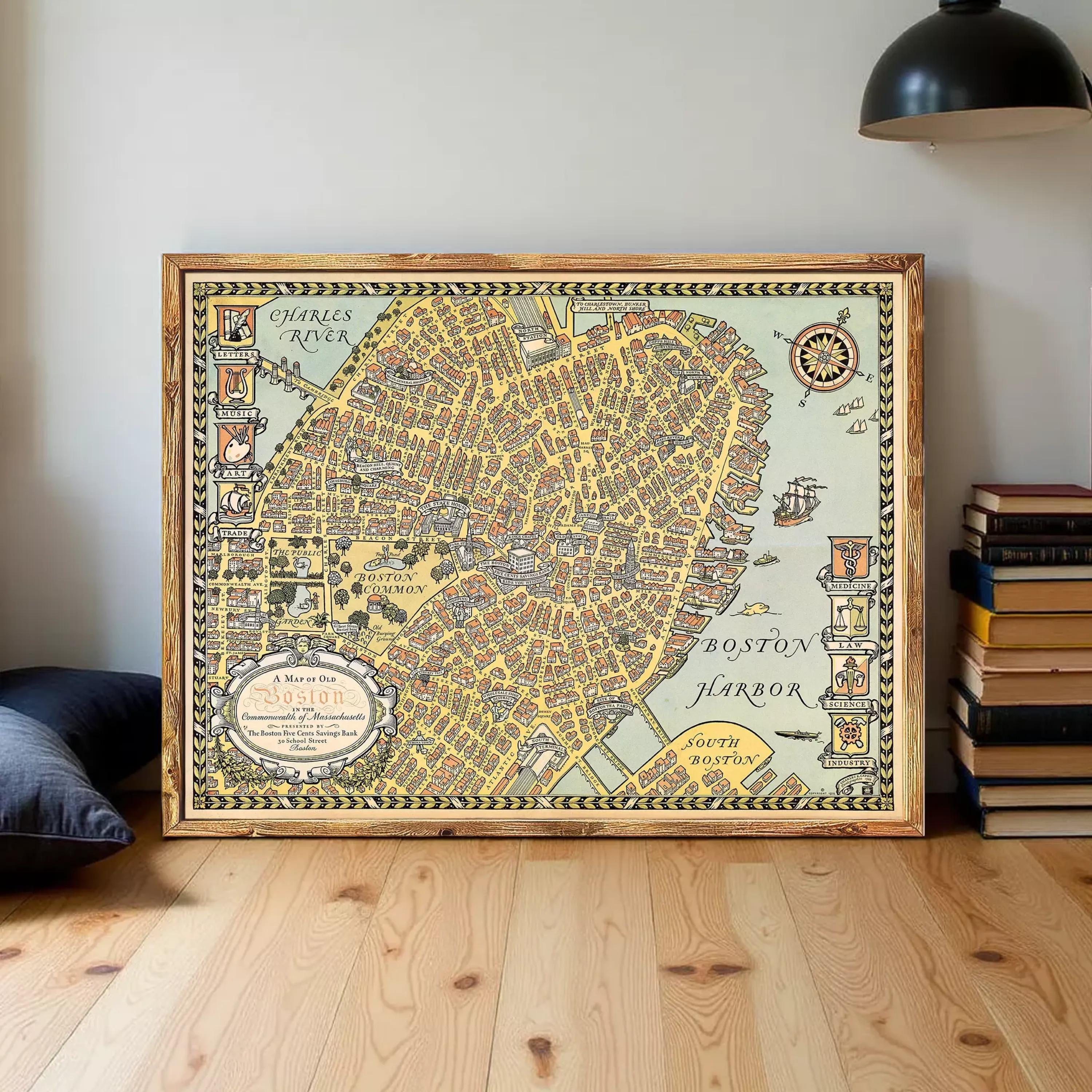 A framed vintage map of Boston, Massachusetts, depicting the city's streets and surrounding areas.