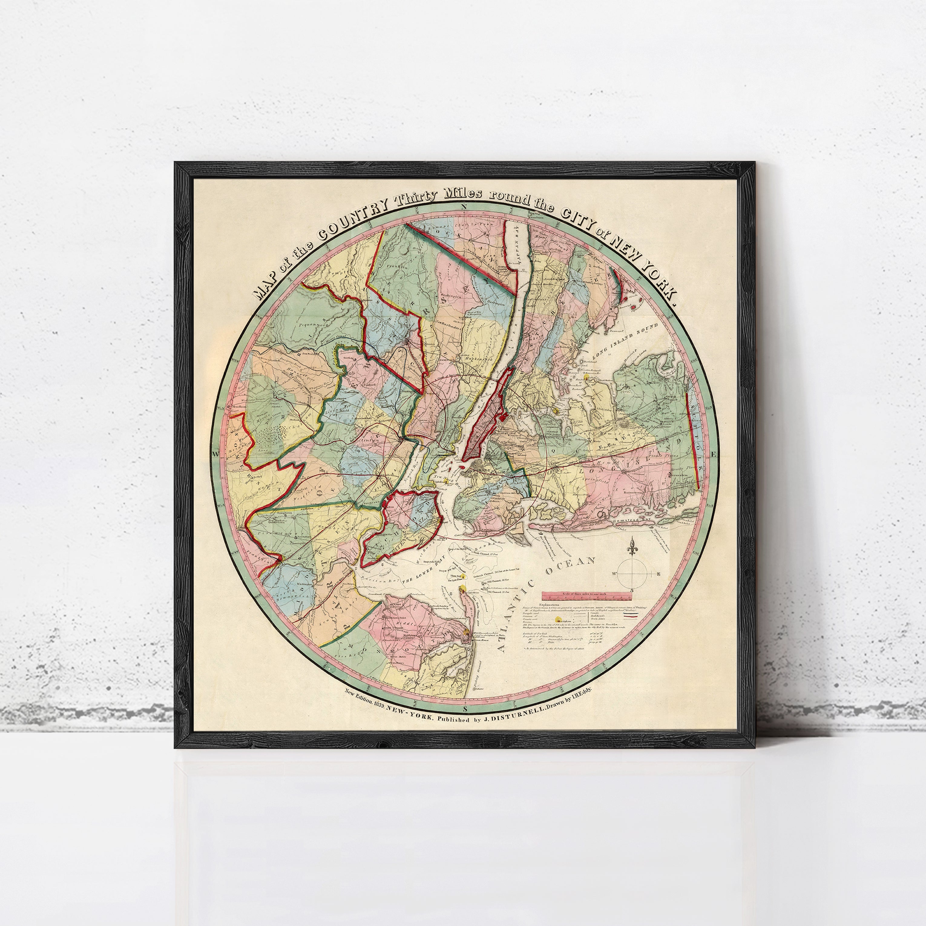 A framed vintage map of New York City, depicting the city's geographical layout and surrounding areas.