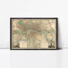 The image is a framed vintage map of London, England, depicting the city's streets, landmarks, and waterways.