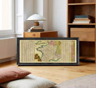 A framed map of Europe and the surrounding areas, with a detailed and colorful depiction of the continent and its countries.