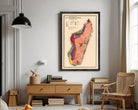 The image is a framed vintage map of Madagascar, depicting the country's geographical features and boundaries.