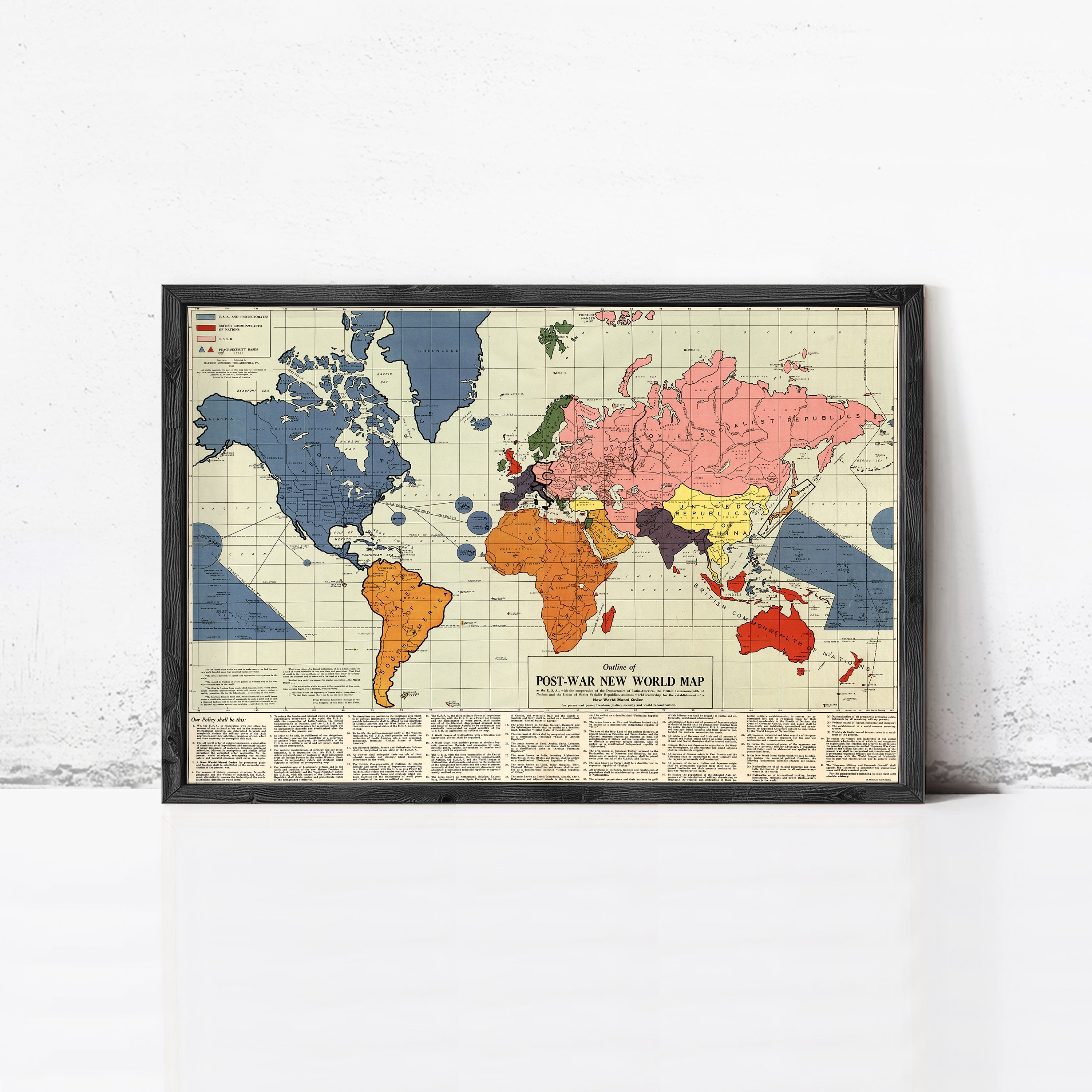 The image is a framed vintage map depicting the world during the post-war period, showing the territorial changes and political shifts that occurred after World War II.