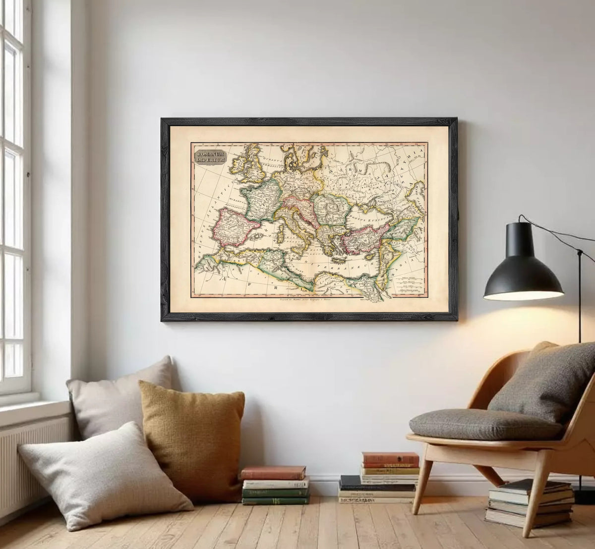 The image is a framed antique map of Europe and the Mediterranean region, displayed on a white wall.
