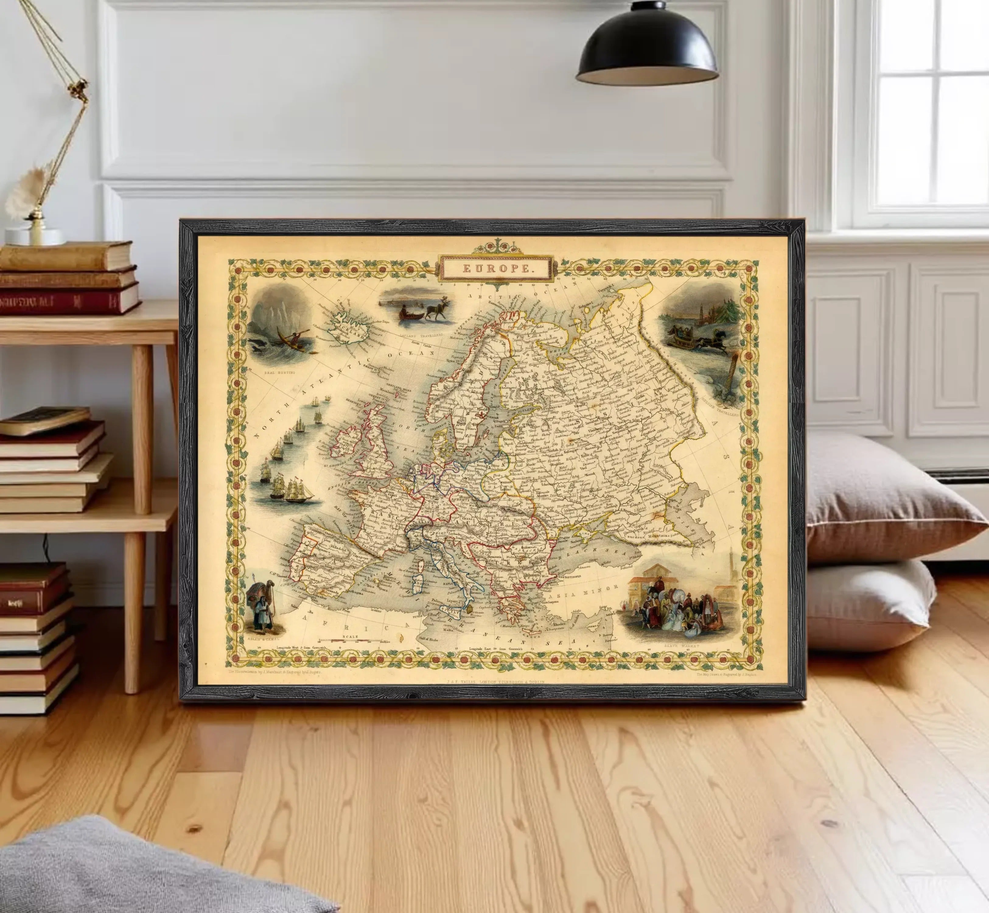 The image is a framed vintage map of Europe, featuring various illustrations and labels.