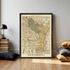 The image is a framed vintage map of a region, likely a country or region, with detailed road networks and various geographical features.