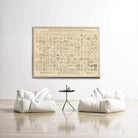 a large framed poster of a map hanging on a white wall, with two white bean bag chairs positioned in front of it.