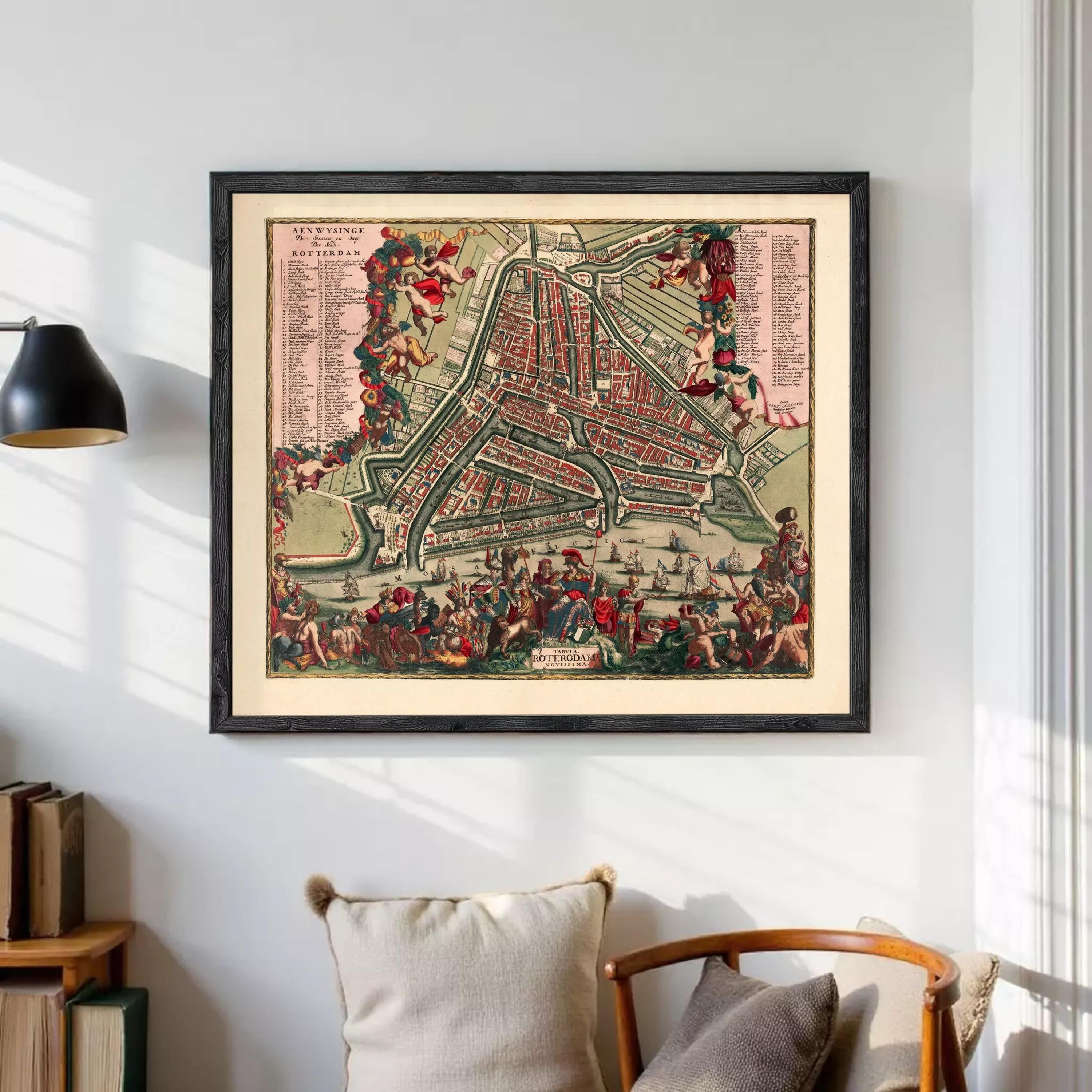 The image is a framed vintage map of Amsterdam, Netherlands, depicting a detailed and colorful representation of the city's streets, canals, and landmarks.