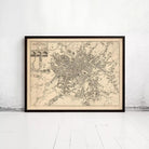 The image is a framed map of a city, likely a historical or geographical map, displayed on a white wall.