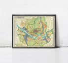 The image is a framed map of a city, showing various streets, landmarks, and geographical features.
