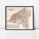 The image is a framed vintage map of Cleveland, Ohio, depicting the city's streets and neighborhoods in a detailed and colorful manner.