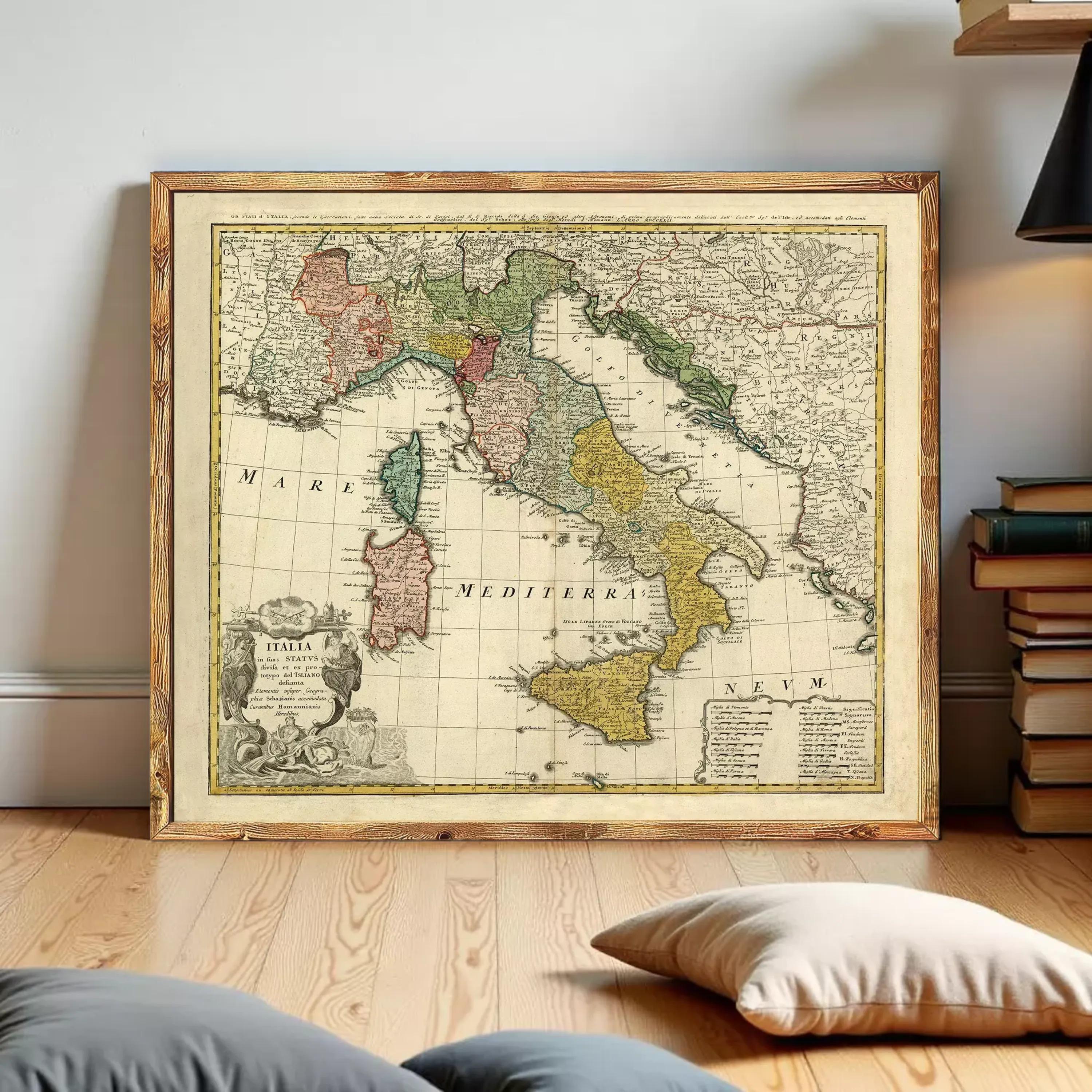 The image is a framed antique map of Italy, showing the country's geographical layout and surrounding areas.
