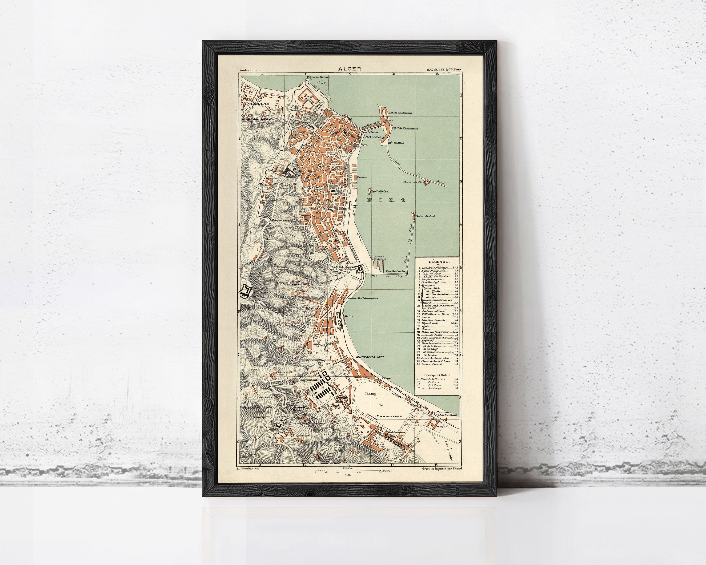 The image is a framed vintage map of a coastal city, likely from the 19th century.