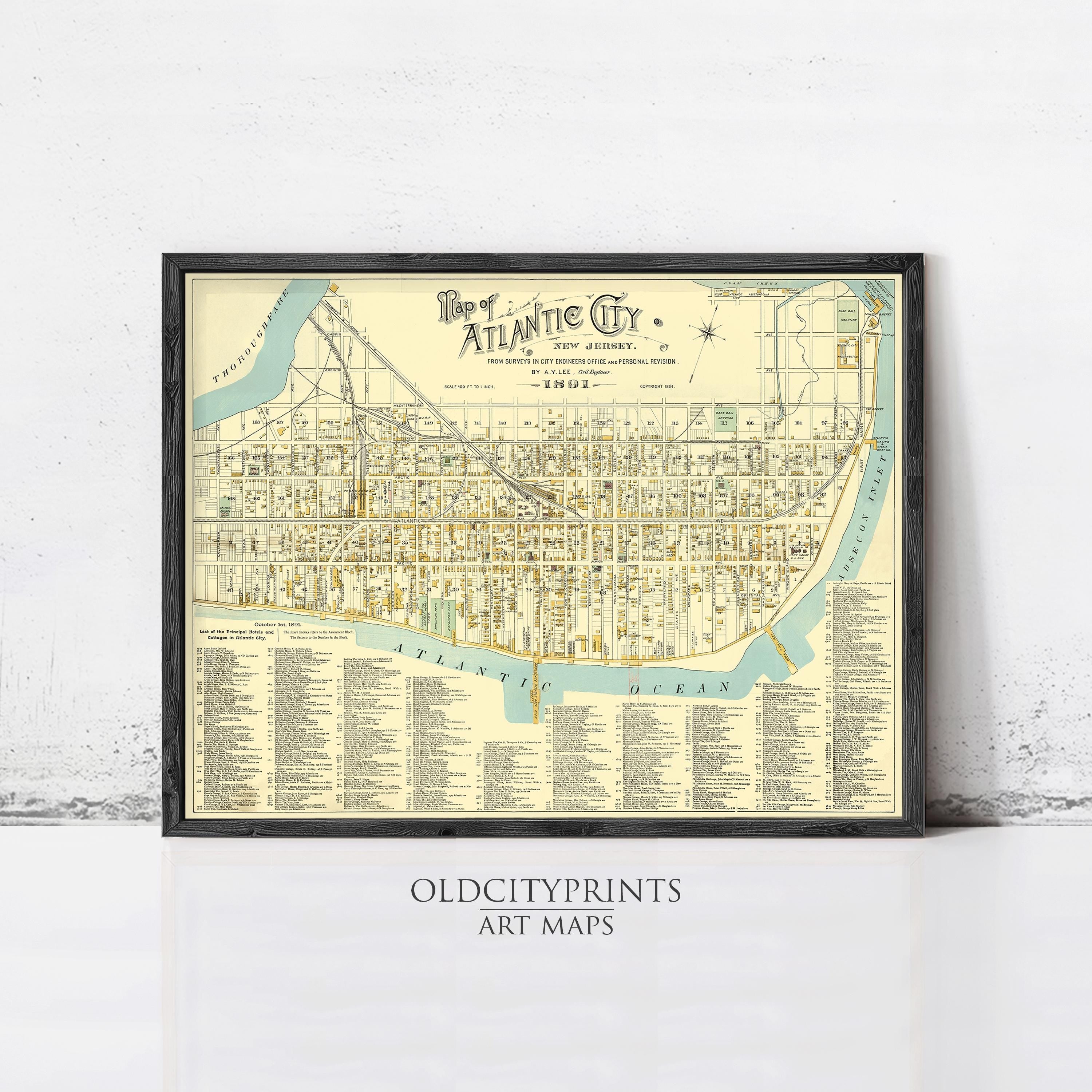 The image is a framed vintage map of the Atlantic City, New Jersey, depicting the city's streets, landmarks, and surrounding areas.