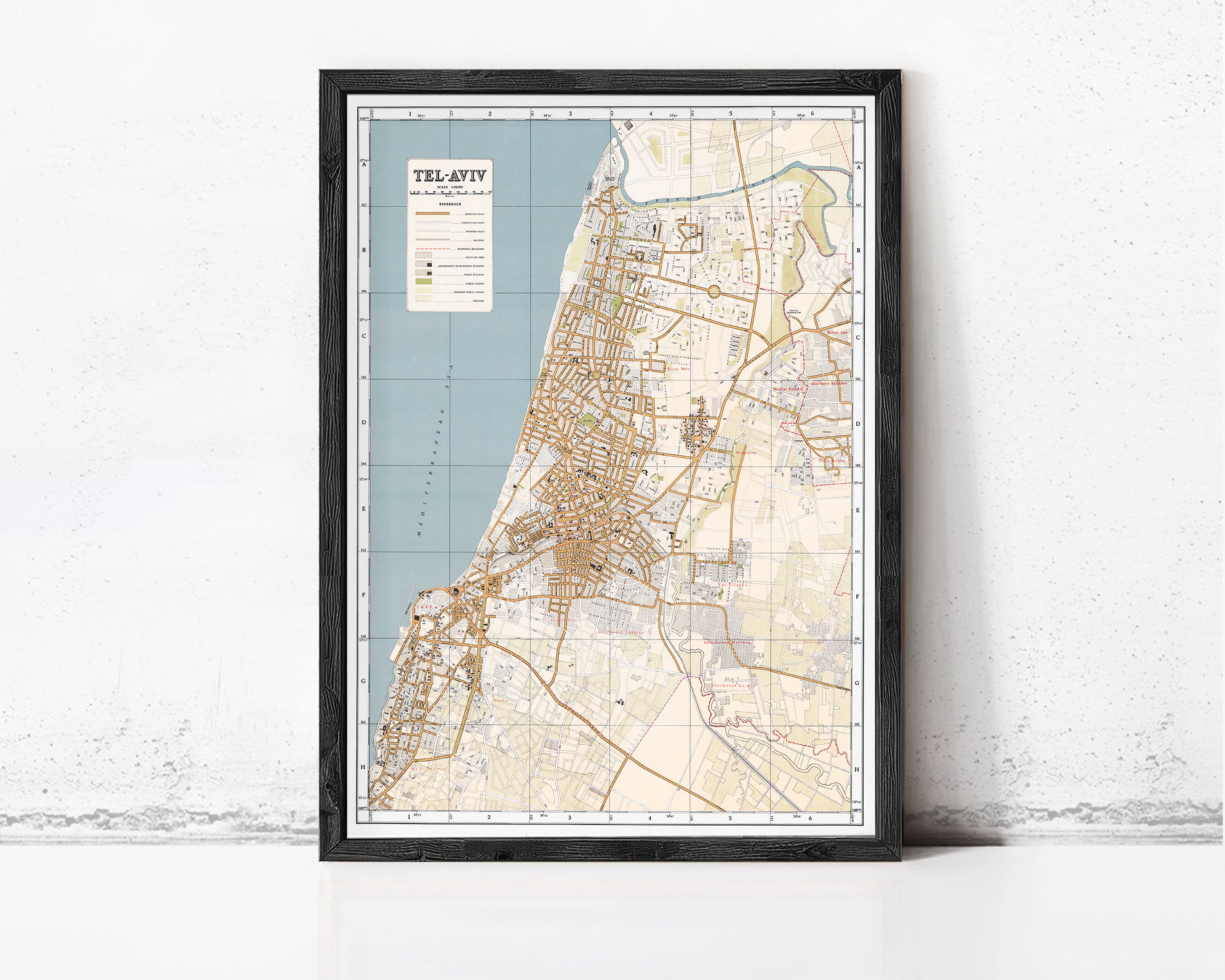 The image is a framed map of Tel Aviv, Israel, showing the city's streets, landmarks, and surrounding areas.