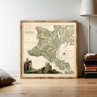 The image is a framed antique map of France, depicting a mountainous region with a river and a small town.