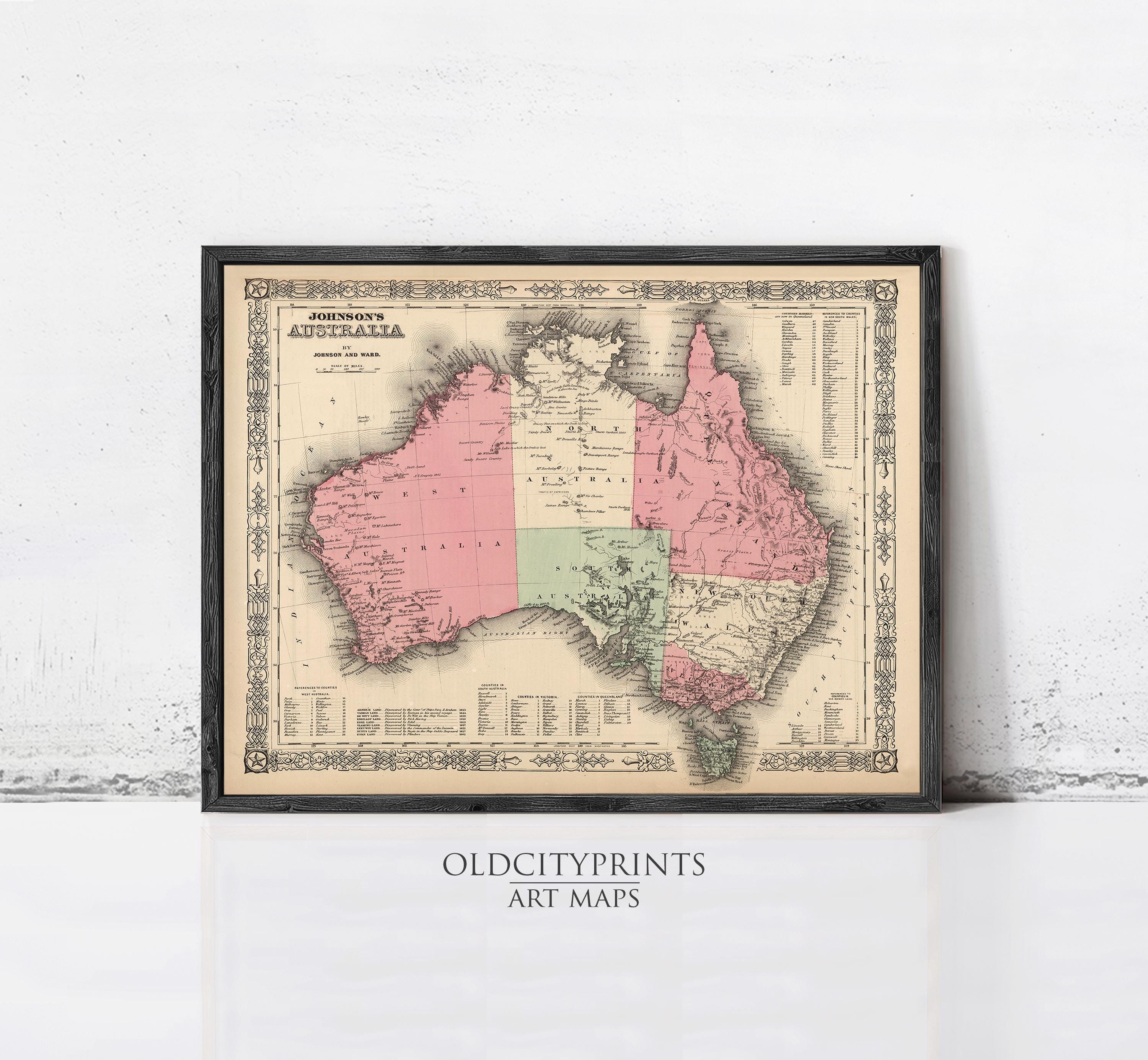 The image is a framed vintage map of Australia, with a black border and a beige background.