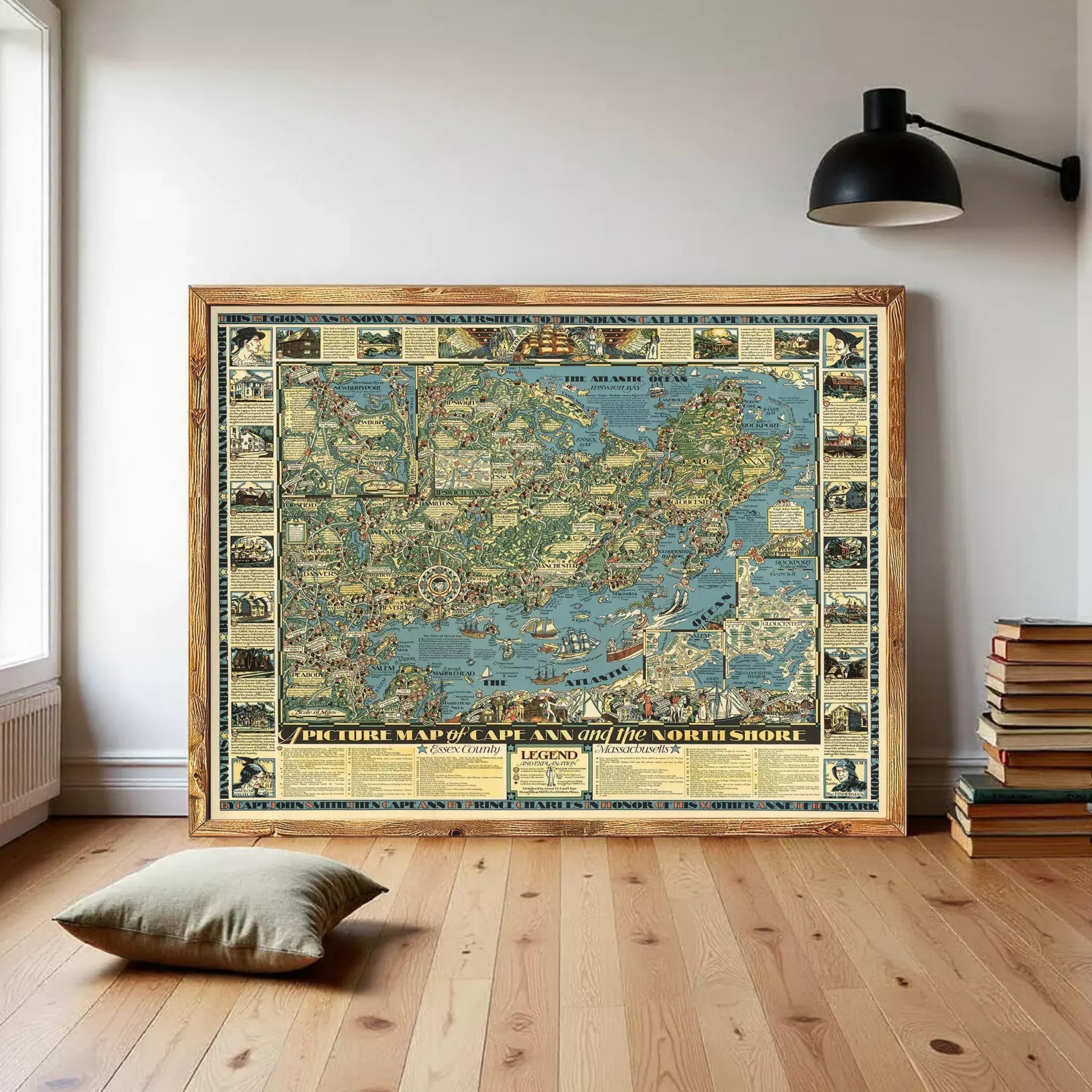 a large framed map of the world, with various illustrations and labels, displayed on a wall in a room with a wooden floor and a stack of books nearby.