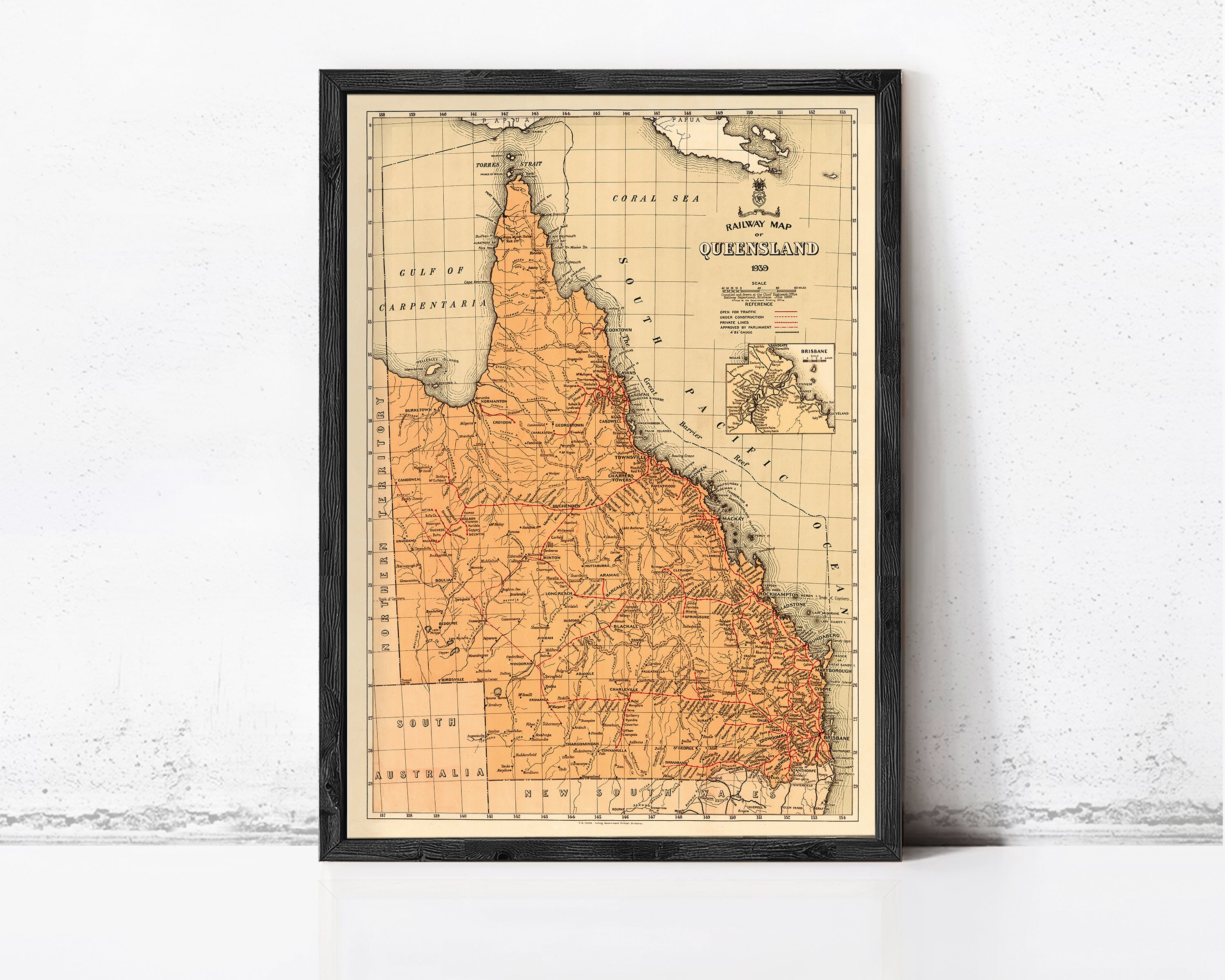 The image is a framed vintage map of the Queensland region of Australia, depicting the state's geographical layout and boundaries.