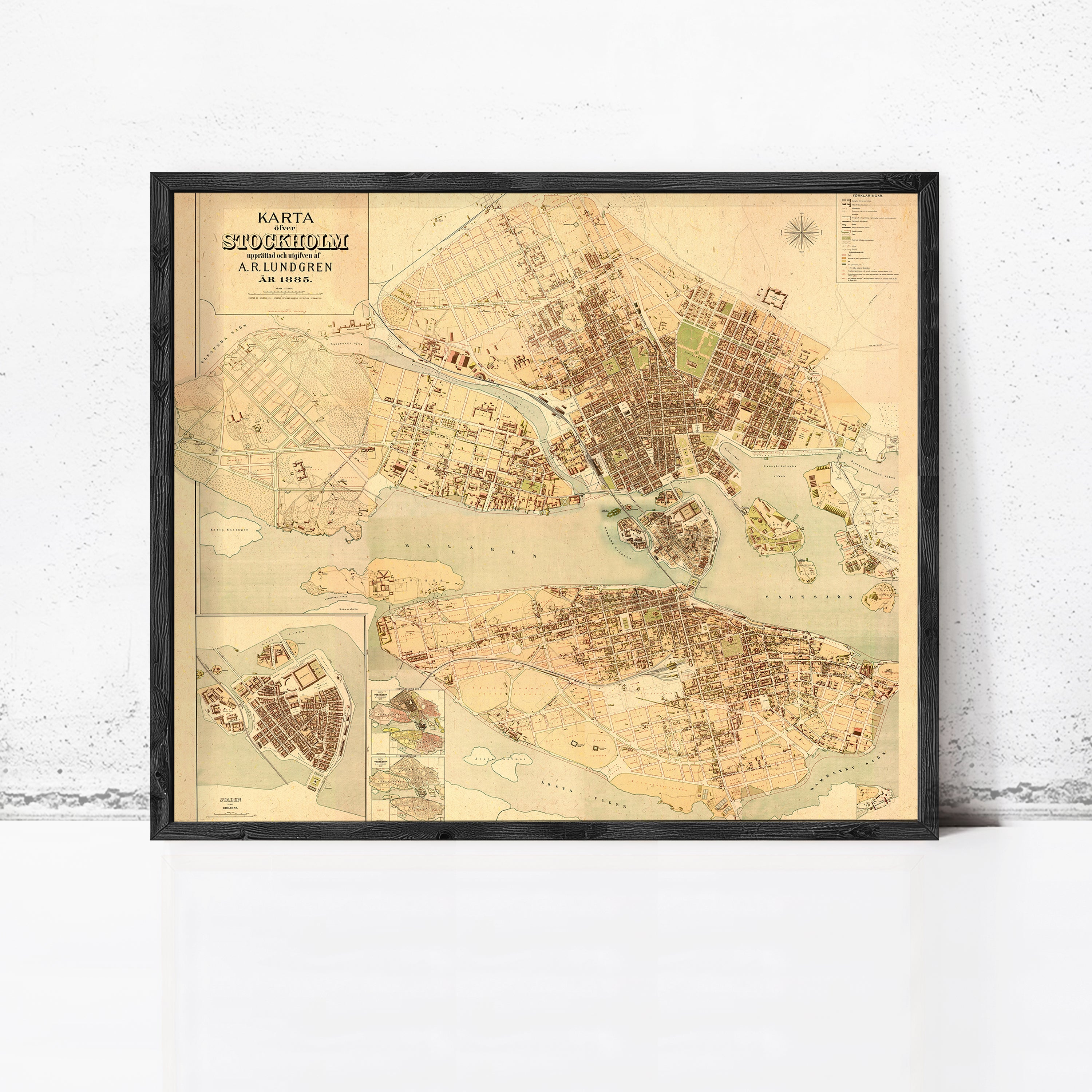 The image is a framed vintage map of Stockholm, Sweden, depicting the city's layout and surrounding areas.