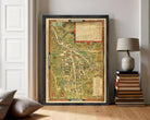 The image is a framed vintage map of a town or city, with detailed illustrations and labels.
