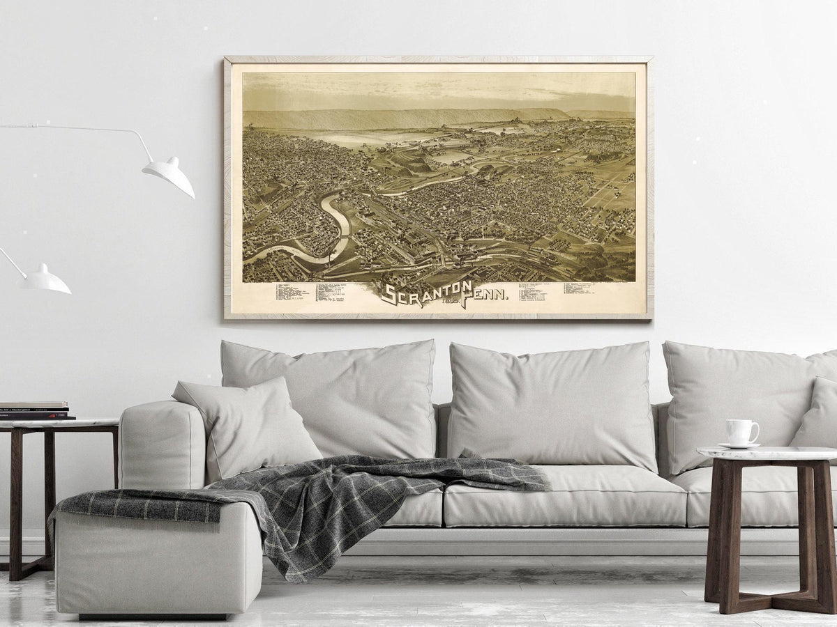 a large framed map of Scranton, Pennsylvania, hanging on a wall above a couch in a living room setting.