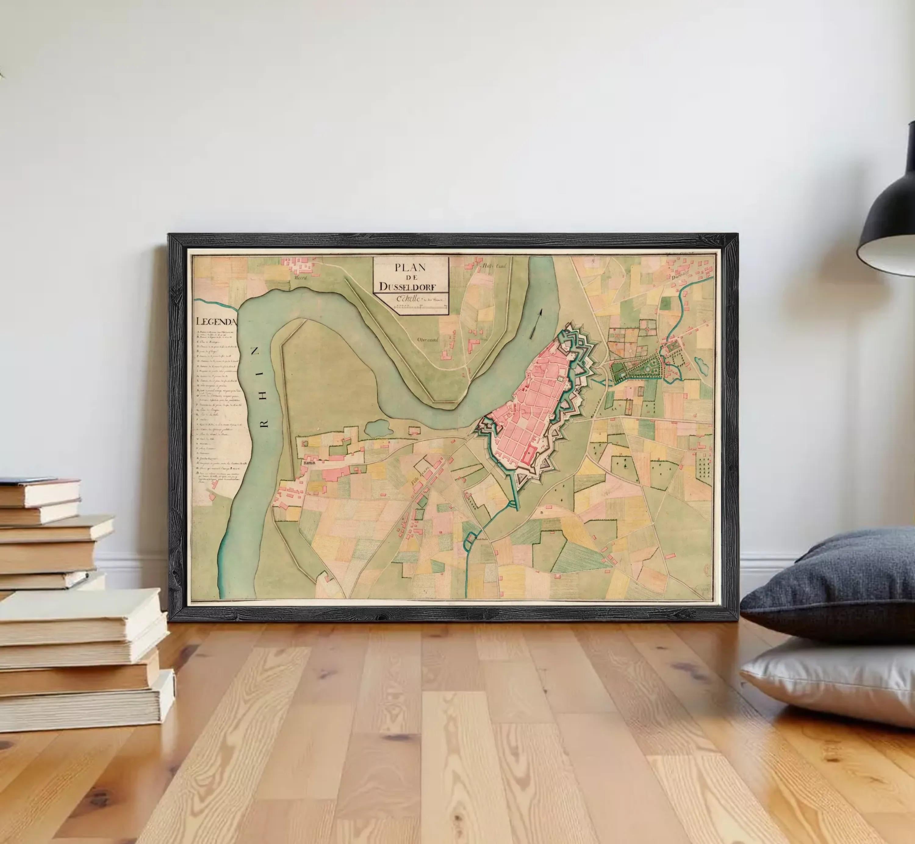 The image is a framed map of a city, depicting various landmarks and geographical features.