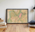 The image is a framed map of a city, depicting various landmarks and geographical features.