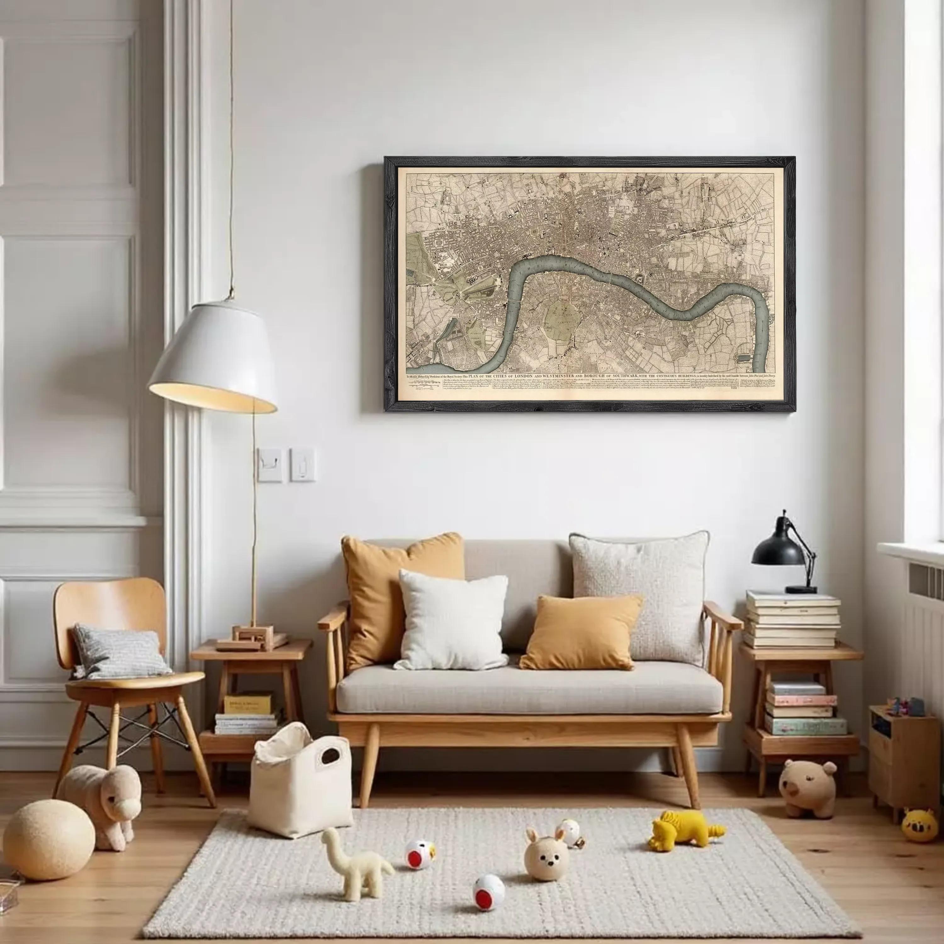 A cozy living room with a large framed map of London hanging on the wall, a wooden sofa with throw pillows, a wooden chair, a lamp, and a small teddy bear.