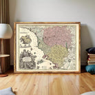 The image is a framed antique map of Europe, featuring detailed illustrations and color-coded regions.