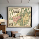 The image is a framed antique map of a city, likely from the 18th century, with detailed cartography and illustrations.