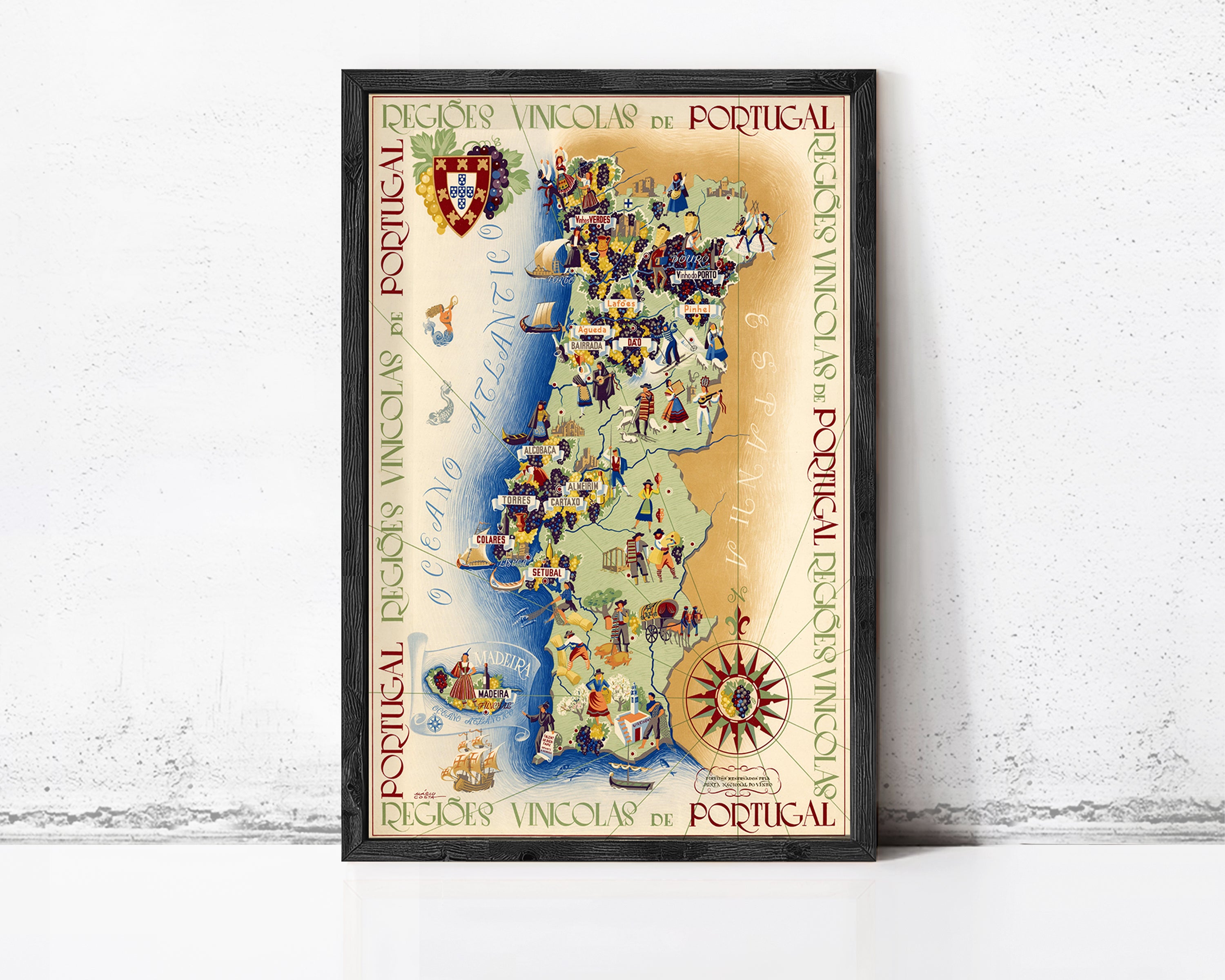The image is a framed vintage map of Portugal, featuring colorful illustrations and text.