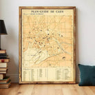 The image is a framed vintage map of Caen, France, depicting the city's layout and surrounding areas.