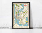 The image is a framed subway map of New York City, depicting the extensive subway network and surrounding areas.