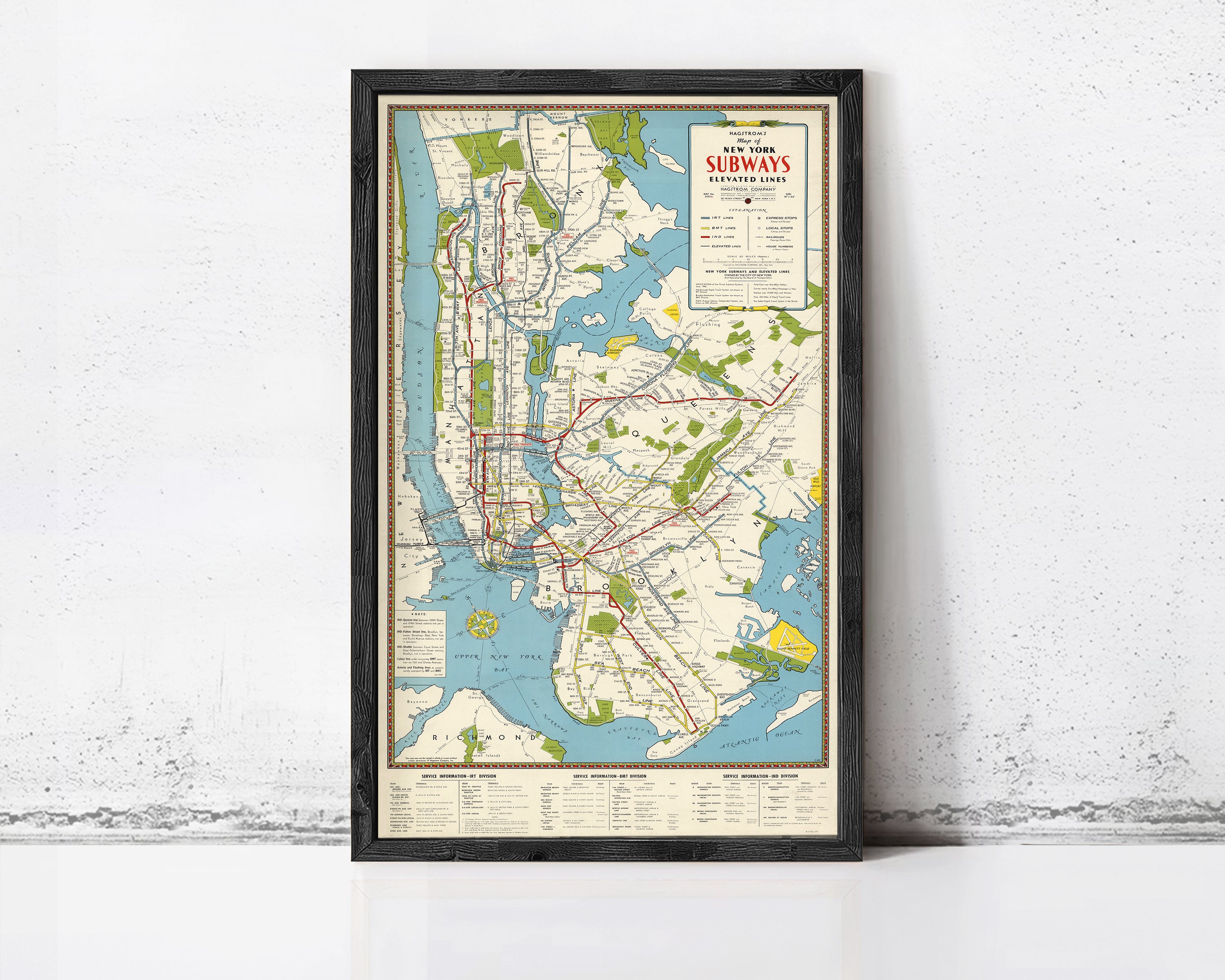 The image is a framed subway map of New York City, depicting the extensive subway network and surrounding areas.