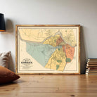 The image is a framed vintage map of Lowell, Massachusetts, depicting the town and surrounding areas in a detailed and colorful manner.