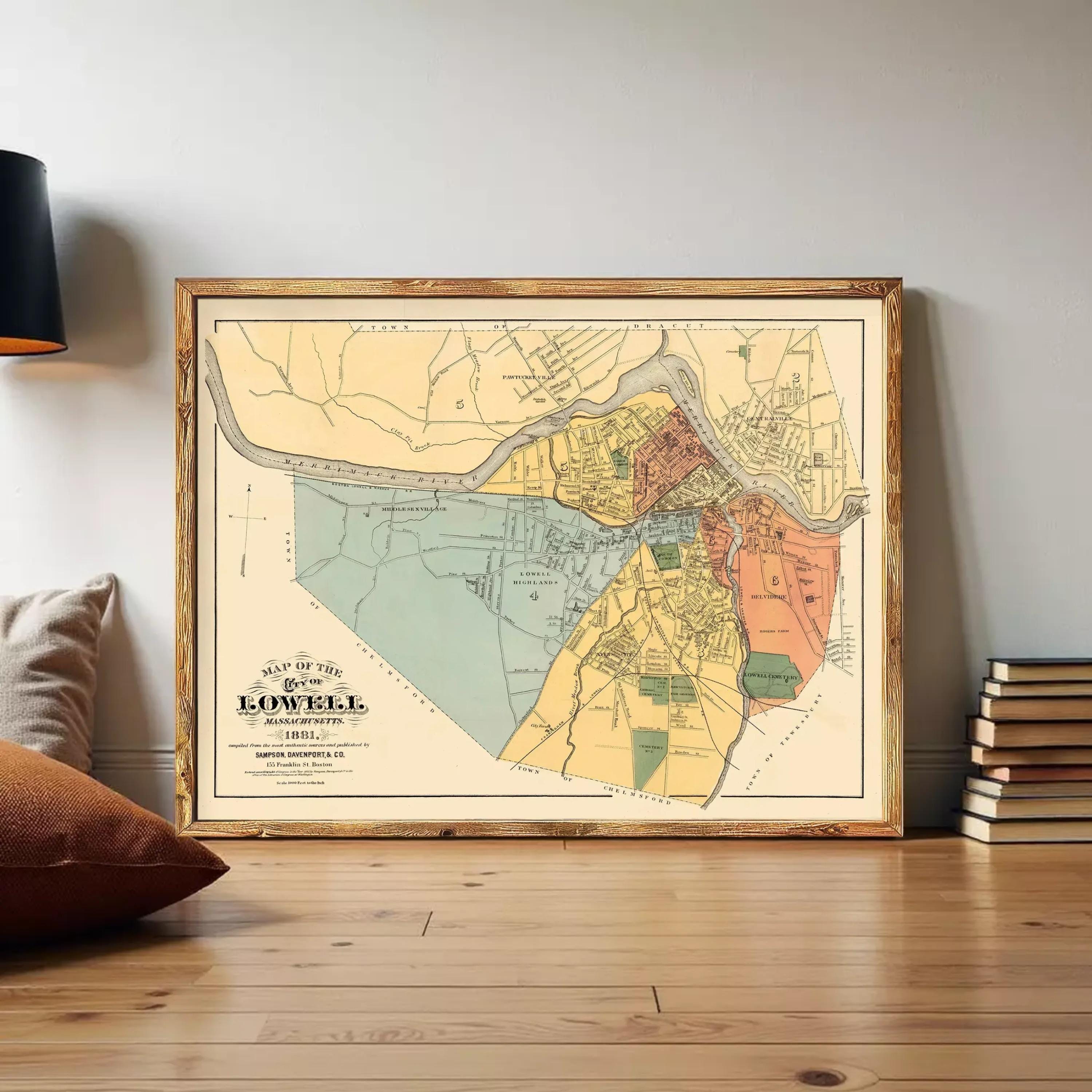 The image is a framed vintage map of Lowell, Massachusetts, depicting the town and surrounding areas in a detailed and colorful manner.