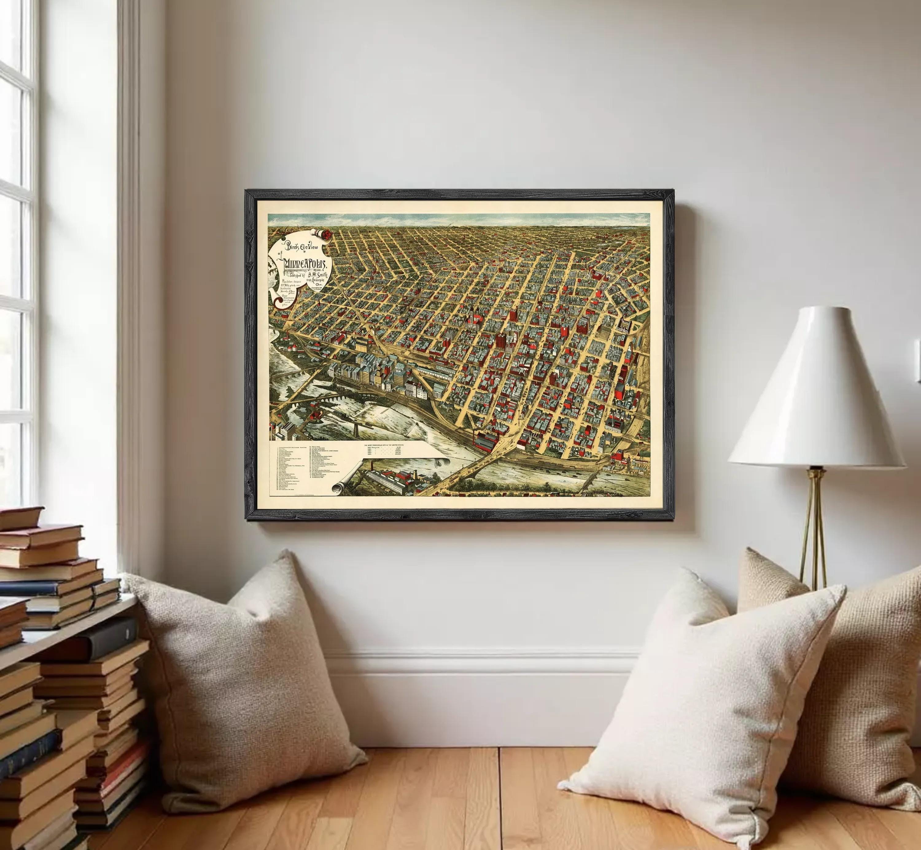 The image is a framed vintage map of a city, depicting a densely populated urban area with numerous buildings and streets.