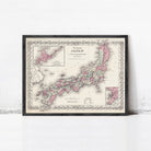 The image is a framed vintage map of Japan, depicting the country in pink and white colors.