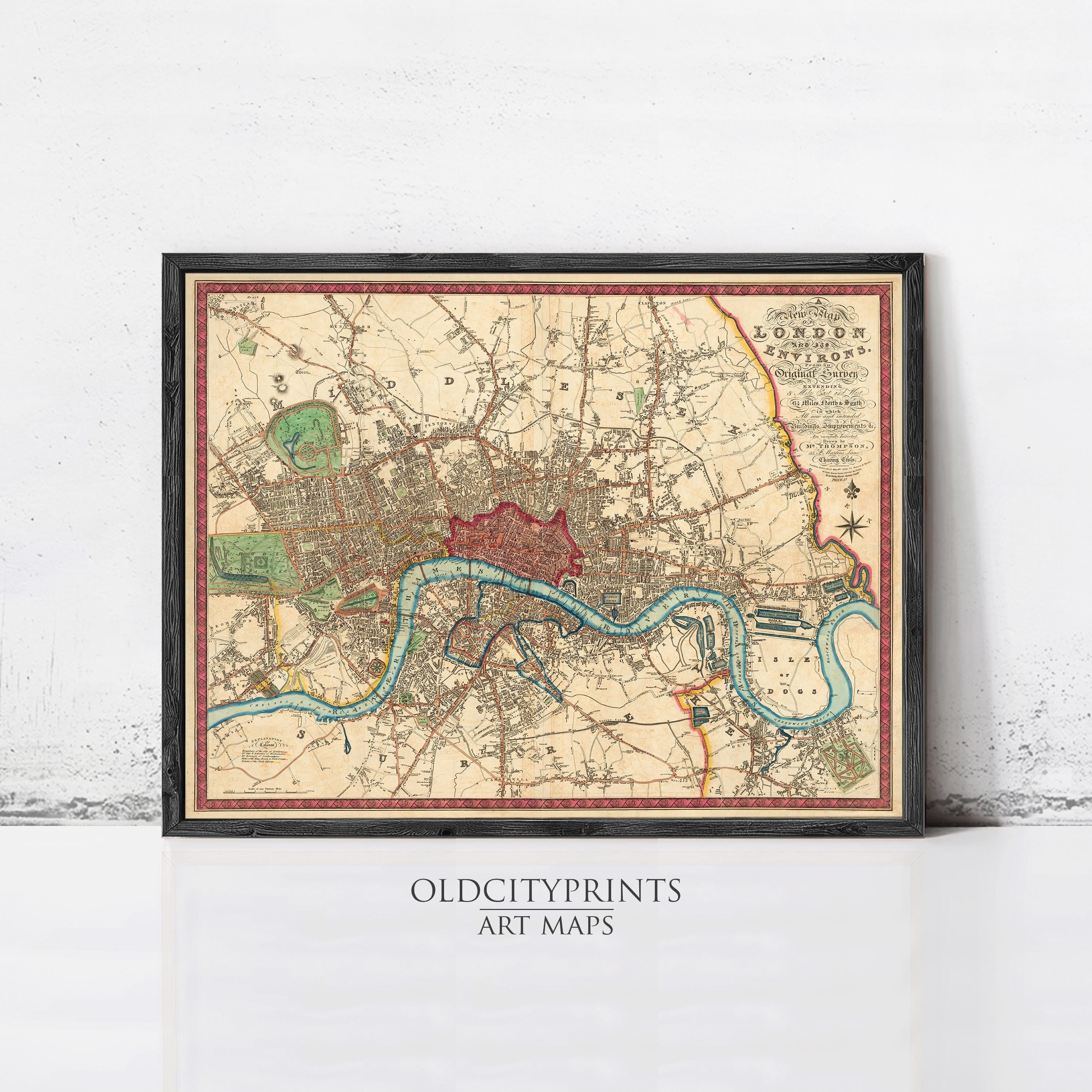 The image is a framed vintage map of London, England, depicting the city's streets, landmarks, and waterways.